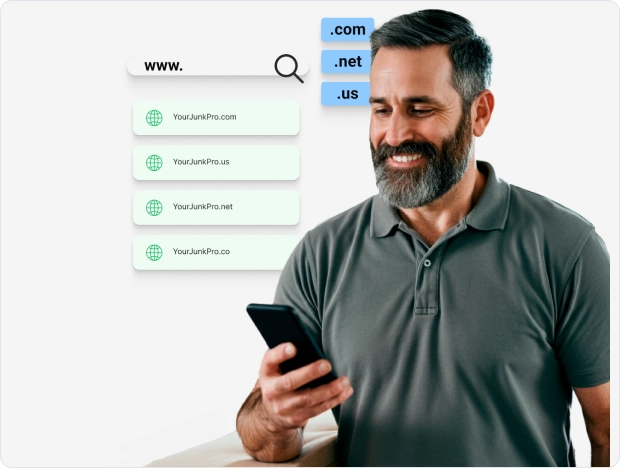 Man smiling at his phone, choosing a custom domain for his junk removal business, with options like .com, .net, and .us displayed.